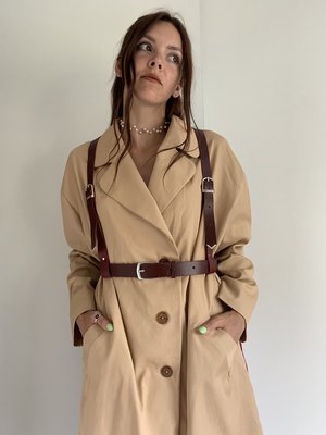 Woman in a coat with a harness