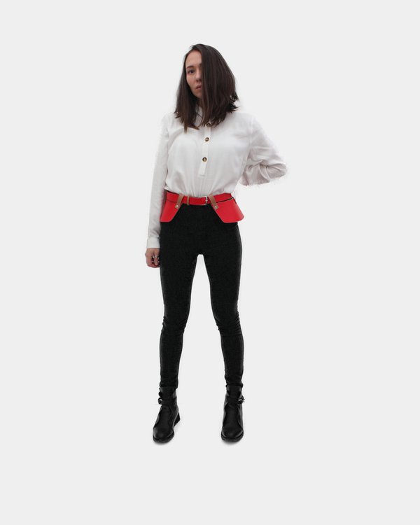 A peplum leather Betsy with a red side dressed on a girl